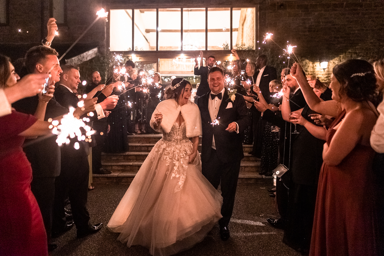 Fiona and Anthony holding a sparkling stick
