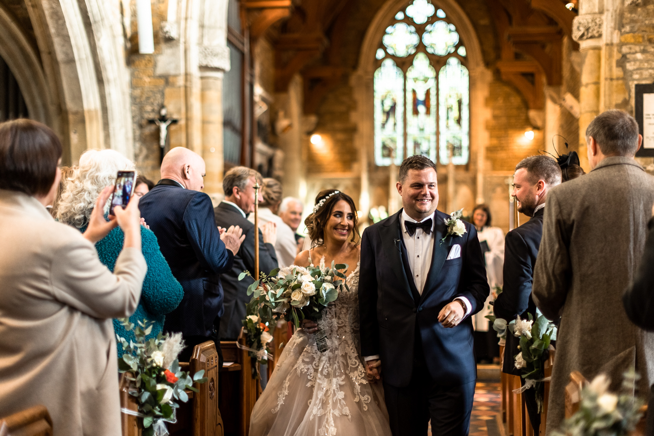 Fiona and Anthony walking down the aisle